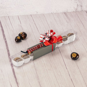 a 1/4 lb. box of our wonderful Buckeyes is packaged with a beaded keychain that says 'go bucks' 