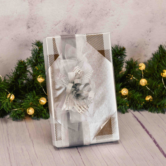 a one pound box of assorted chocolates wrapped in silver and topped with a lovely handmade bow. 