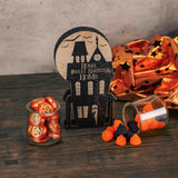 a wooden decorative block that reads 'home sweet haunted home' is packaged with candy