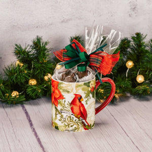 a mug featuring a cardinal is filled with a half pound assortment of milk chocolates. 