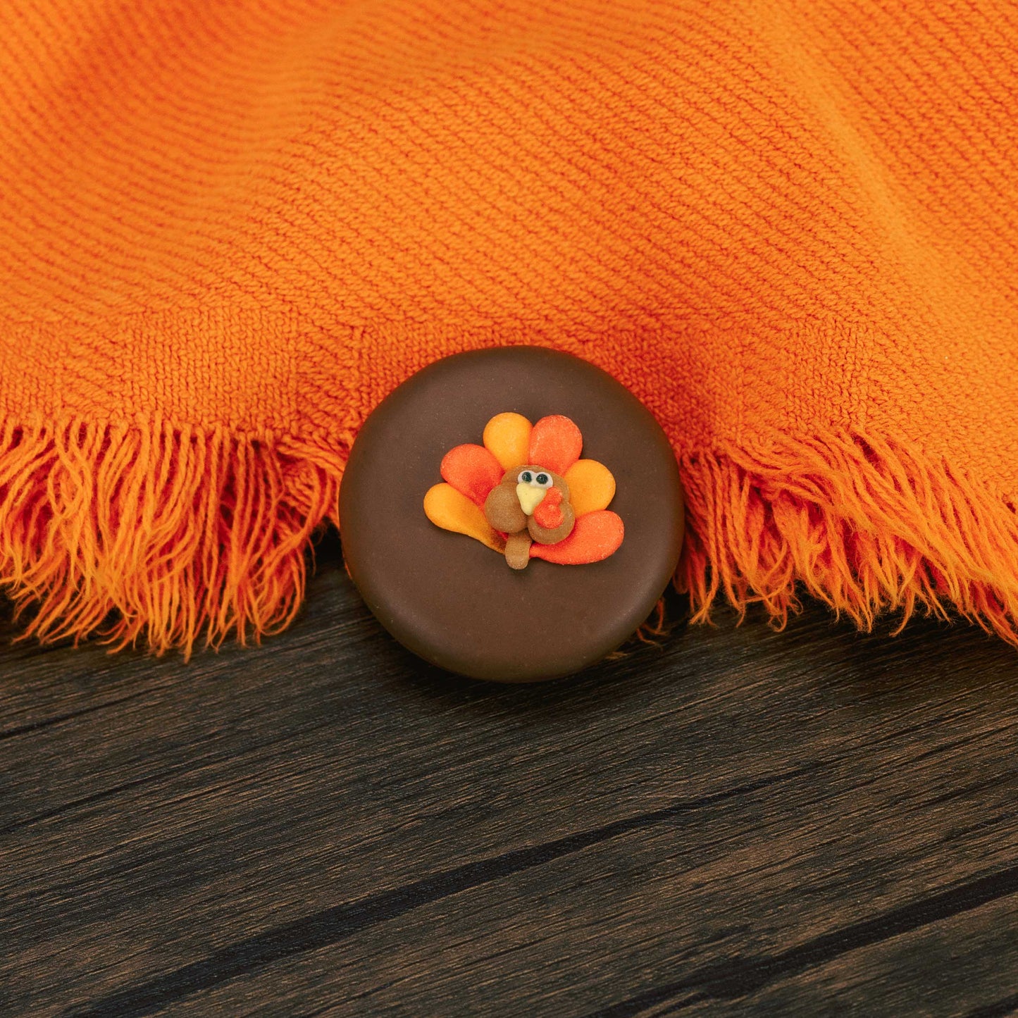 milk chocolate covered oreo with a turkey sugar decoration on top
