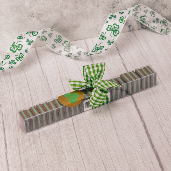 a sleeve of mint meltaways is tied with a bow and a shamrock sticker.
