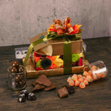 Classic chocolates make this stack a fabulous gift for any fall occasion as it is wrapped in beautiful fall leaf paper and tied with a lovely handmade bow. Tasty treats include: 1/4 lb. Sea Salt Sallies 1/2 lb. Sour Jelly Pumpkins 1/2 lb. Milk Chocolate Malt Balls 1/2 lb. Milk Chocolate Potato Chips 1 lb. Milk & Dark Assortment