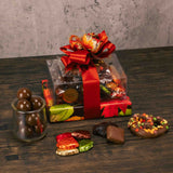 Classic chocolates make this stack a fabulous gift for any fall occasion as it is wrapped in beautiful fall leaf paper and tied with a lovely handmade bow. Tasty treats include: Fall Jumbo Pretzel 1/4 lb. Milk Chocolate Foil Leaves 1/2 lb. Milk Chocolate Malt Balls 1/2 lb. Milk & Dark Assortment
