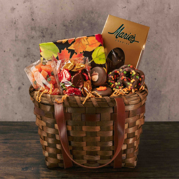 The autumn season will be more sweet with this festive basket featuring a large selection of our delightfully delicious festive treats. Placed in a clear cello bag and tied with a lovely handmade bow, this gift will impress all. Candy includes:  2 Fall Oreos  2 Fall Jumbo Pretzels  1/2 lb. Sour Jelly Pumpkins  1/2 lb. Milk Chocolate Foil Leaves  1/2 lb. Milk Chocolate Potato Chips  1/2 lb. Milk and Dark Assorted Chocolates
