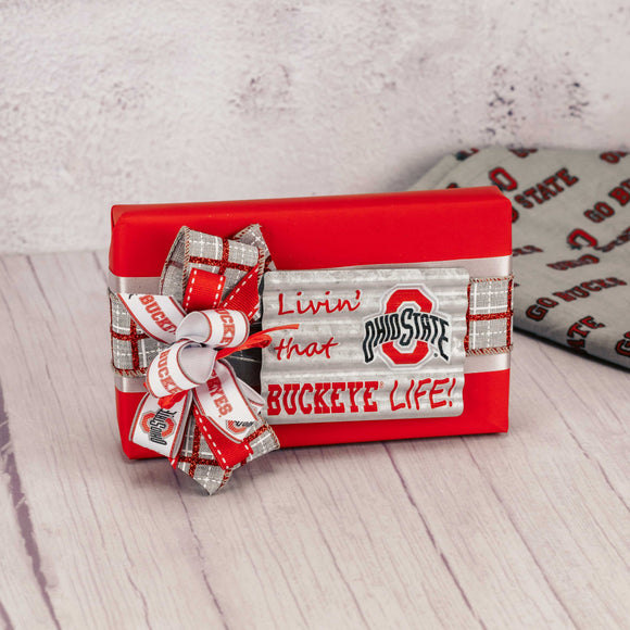 a half pound box of Buckeyes with a metal galvanized magnet that reads 'livin' that buckeye life' 