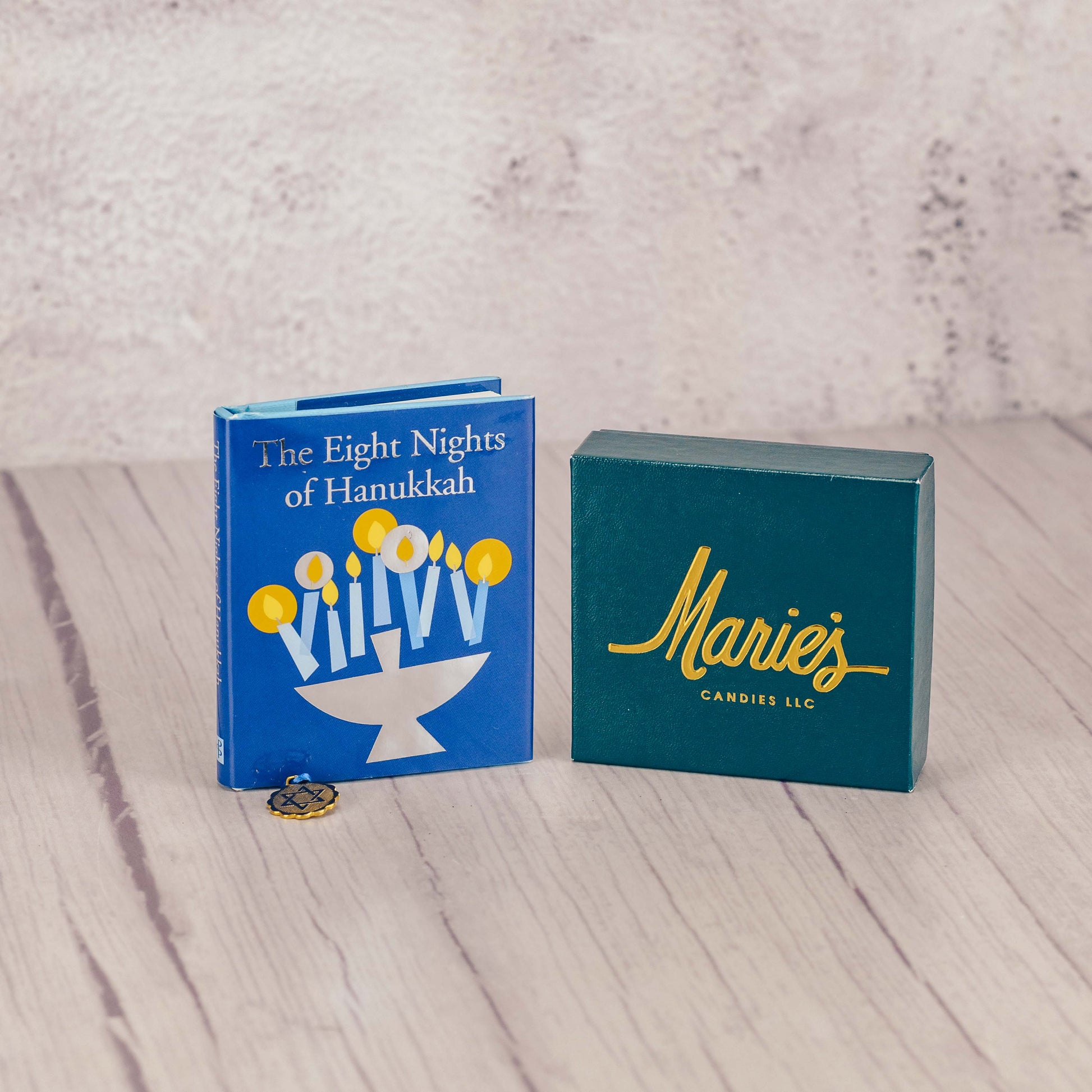 A sampler box of assorted chocolates packaged with a petite book about Hanukkah 'The Eight Nights of Hanukkah' 
