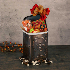 a medium dark brown bronze pinecone canister with lid filled with festive fall candy