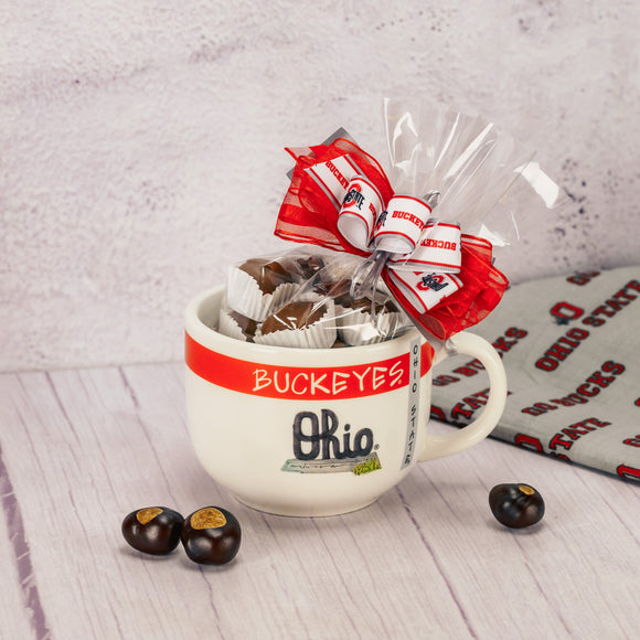 A white soup mug filled with a half pound of milk assorted chocolates