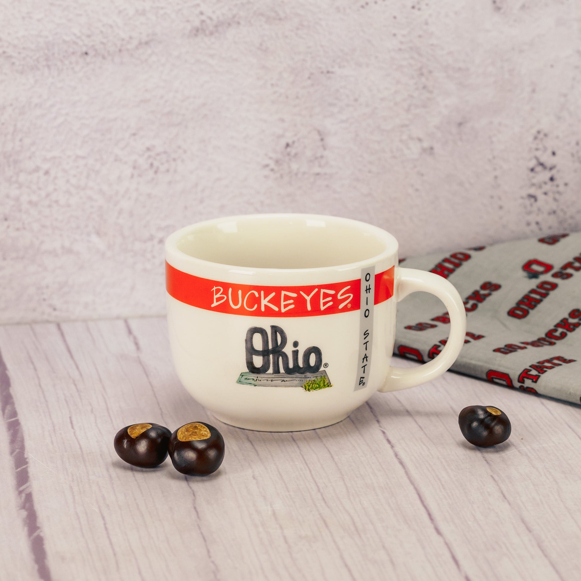A white soup mug filled with a half pound of milk assorted chocolates