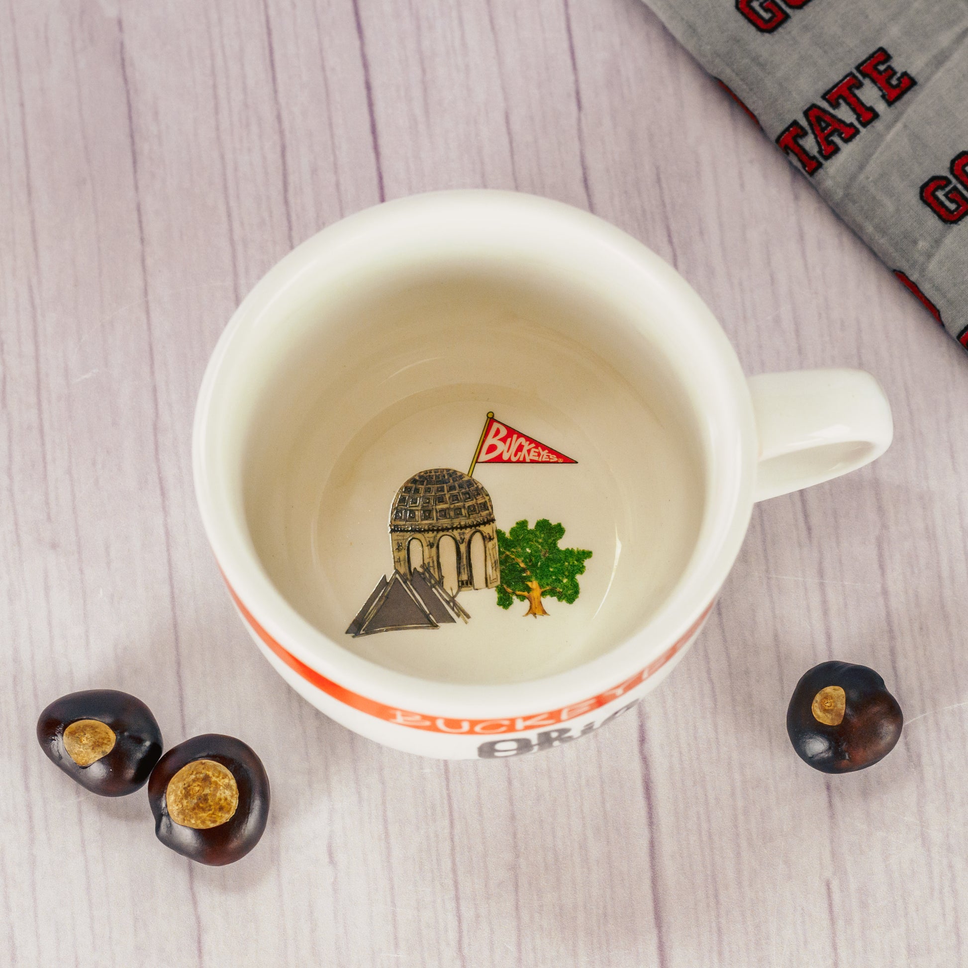 A white soup mug filled with a half pound of milk assorted chocolates
