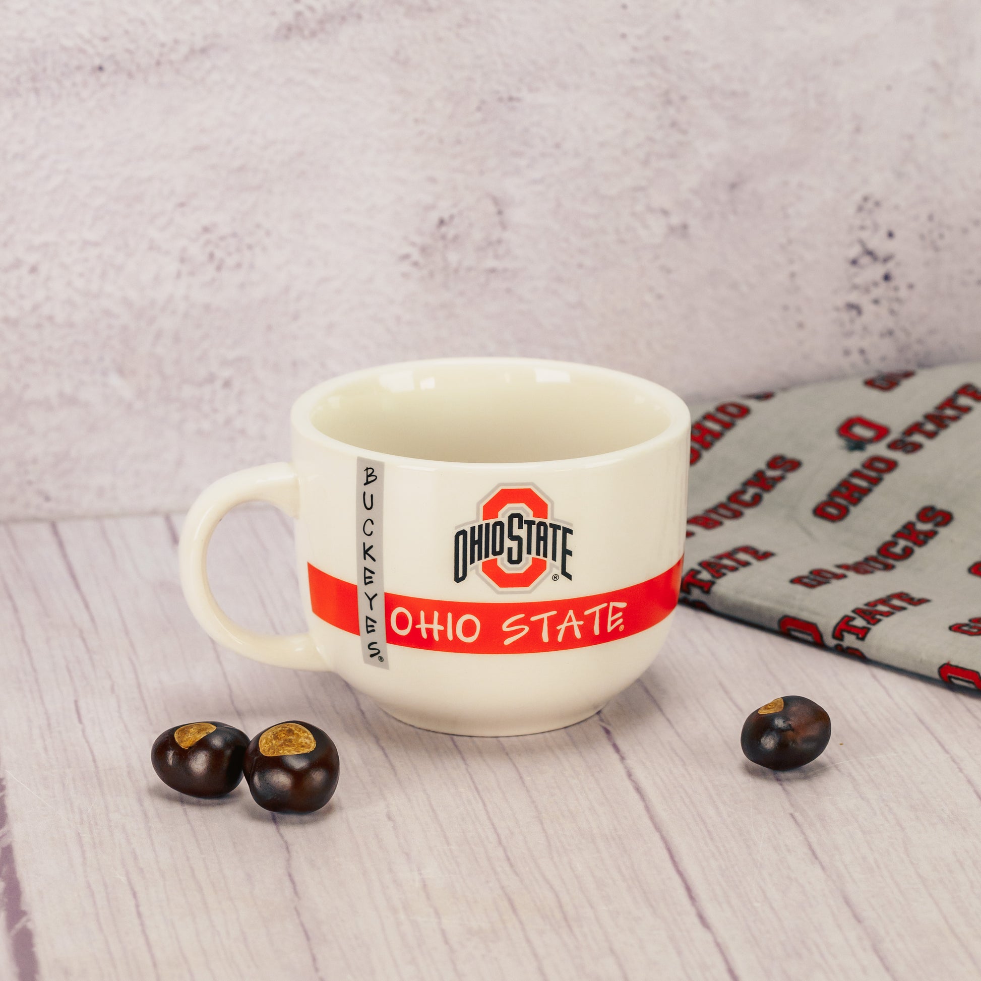 A white soup mug filled with a half pound of milk assorted chocolates