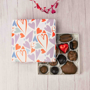 Colorful hearts doodled all over the box, friends and family will feel the love with this gesture. A half pound box of our indulgent milk and dark Assorted Chocolates will make all your loved ones feel appreciated this year!