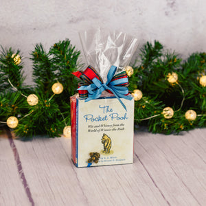 a pocked-sized book full of wit and whimsical portions of Winnie the Pooh is packaged with a sampler box of assorted chocolates