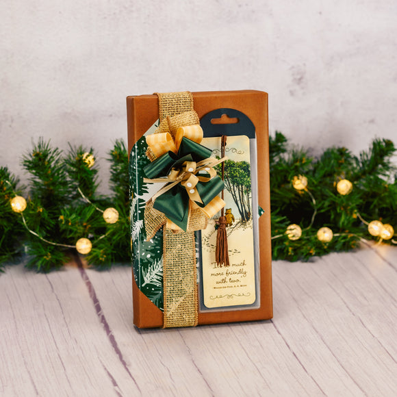 a one pound box of assorted chocolates is wrapped and topped with a Winnie the Pooh and piglet bookmark