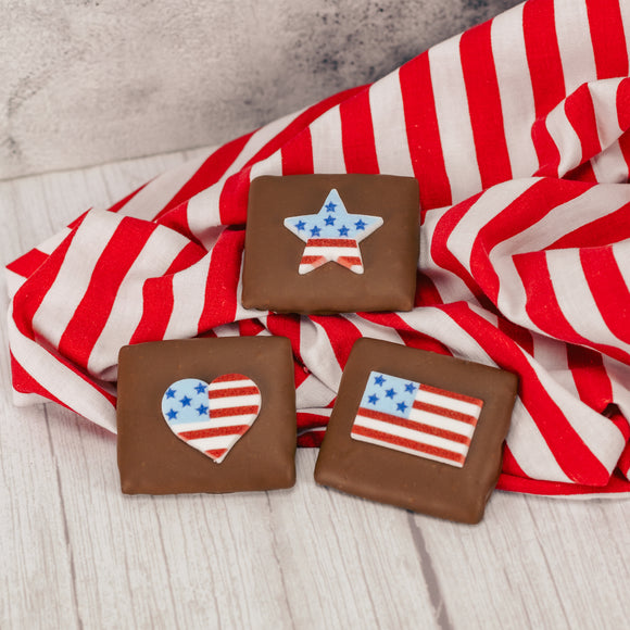 Our wonderful, silky-smooth milk chocolate turns a simple graham cracker into a decadent treat - even better with a patriotic sugar decoration on top! Packaged individually for a perfect sized snack. Assorted decoration styles.