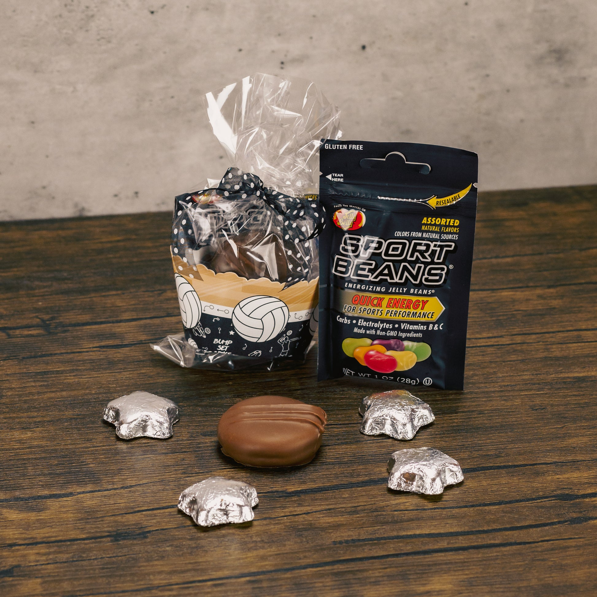 a clear cello bag filled with candy and at paper volleyball cuff around it.