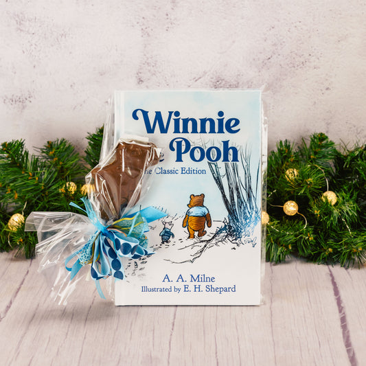 Winnie the Pooh classic edition book packaged with a chocolate pooh bear sucker