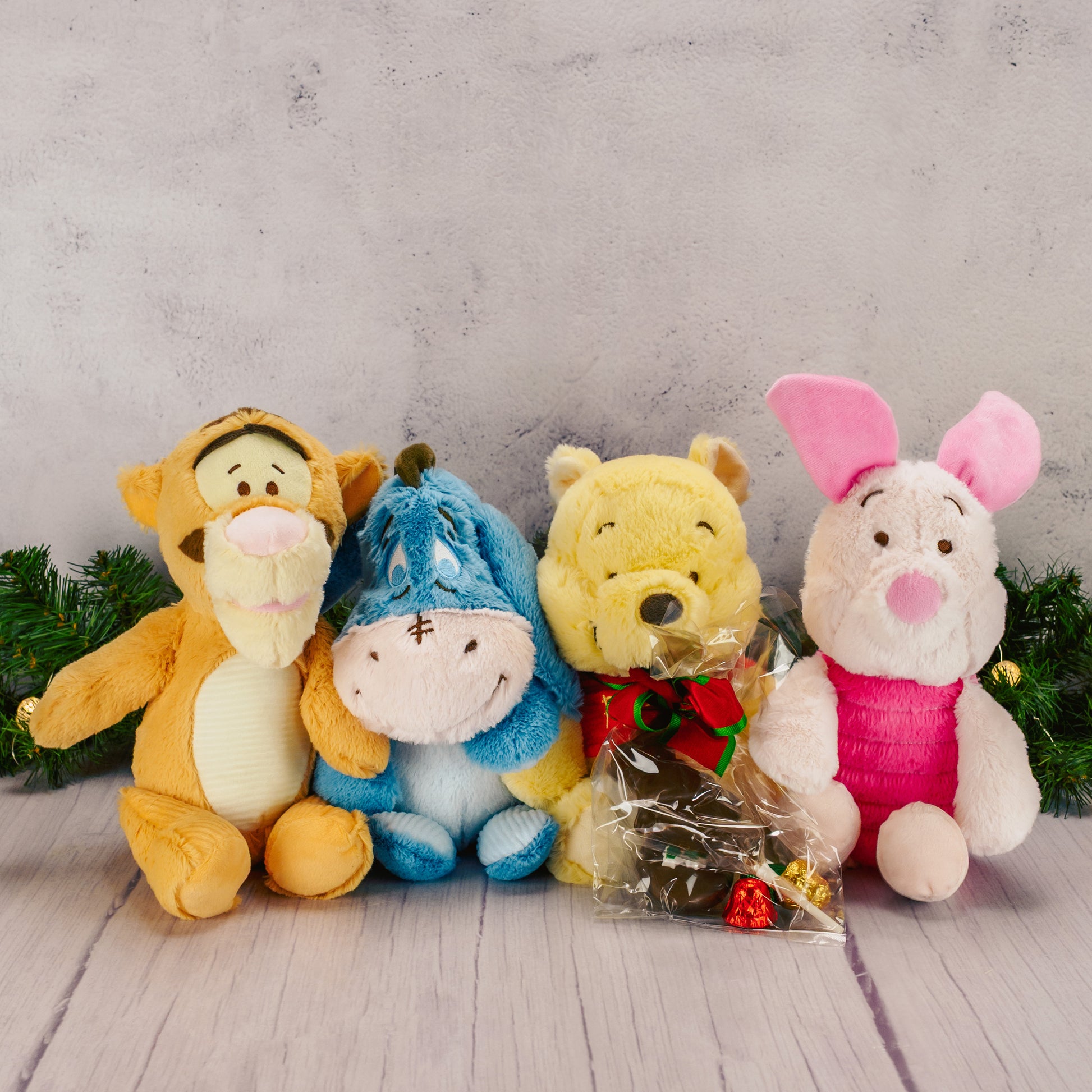enjoy the hundred acre crew plush with a bag of sweet treats