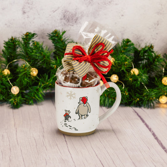 a half pound of assorted milk chocolate is packaged inside a Winnie the Pooh mug walking in winter with piglet