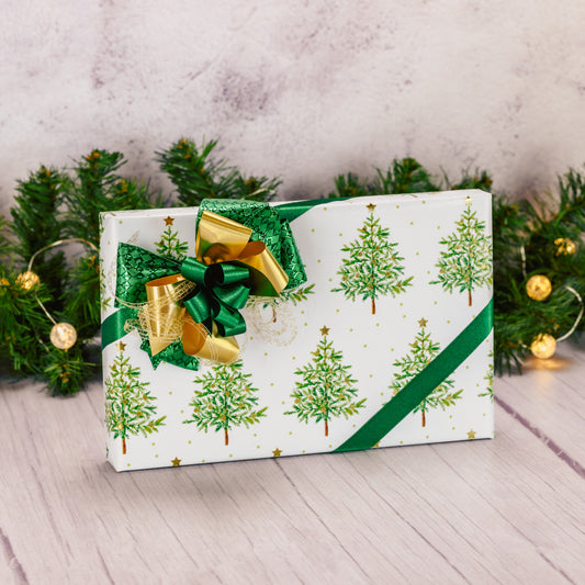 half pound box of sugar free assorted chocolates is wrapped in holiday paper and topped with a handmade bow