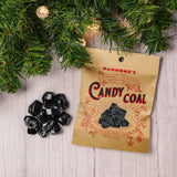 a small bag of coal looking cinnamon flavored hard candy for those 'bad kids'