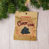 a small bag of coal looking cinnamon flavored hard candy for those 'bad kids'