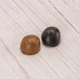 a pound box of maple cream centers covered in smooth milk or rich dark chocolate.