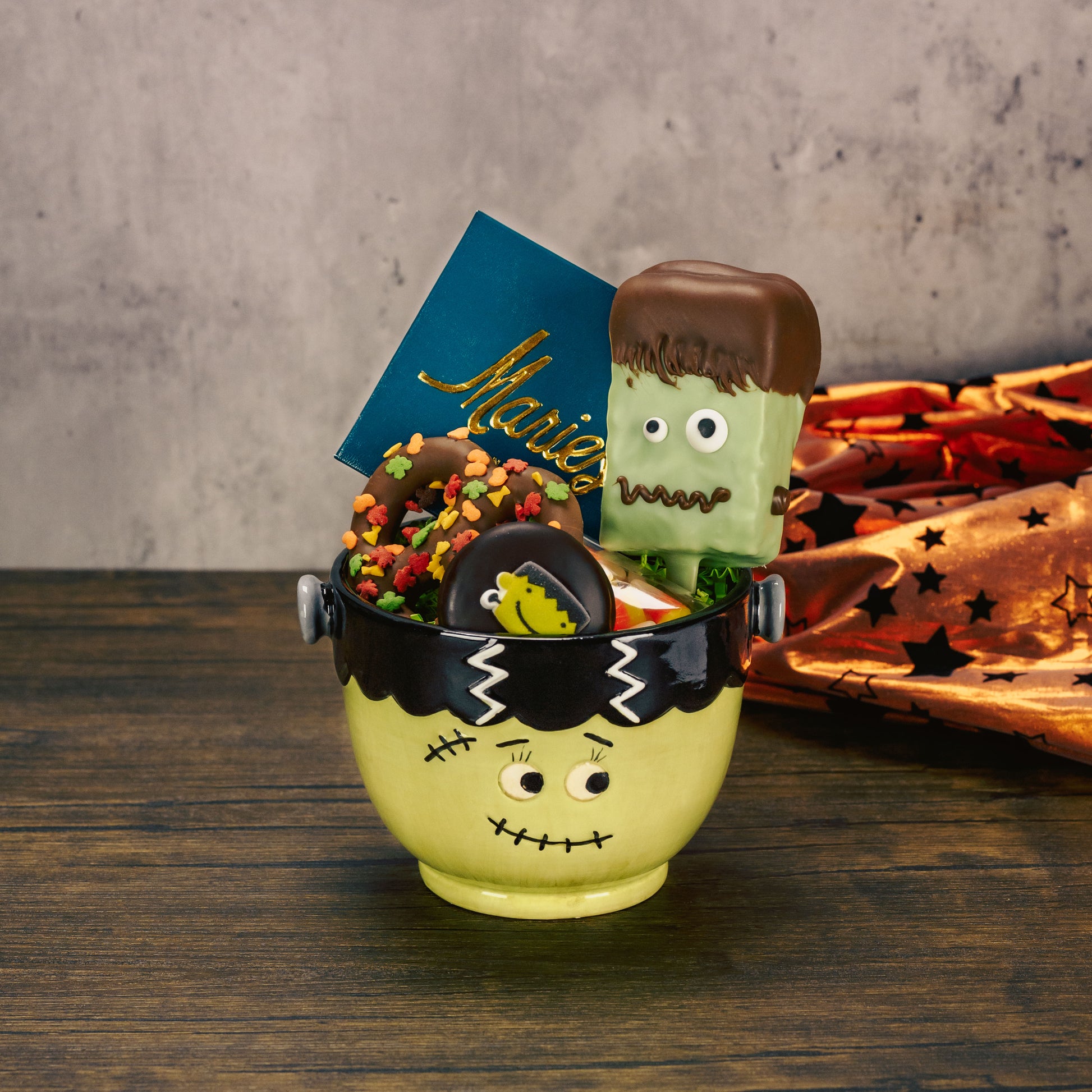A monster Bride  bowl is filled with sweet treats.