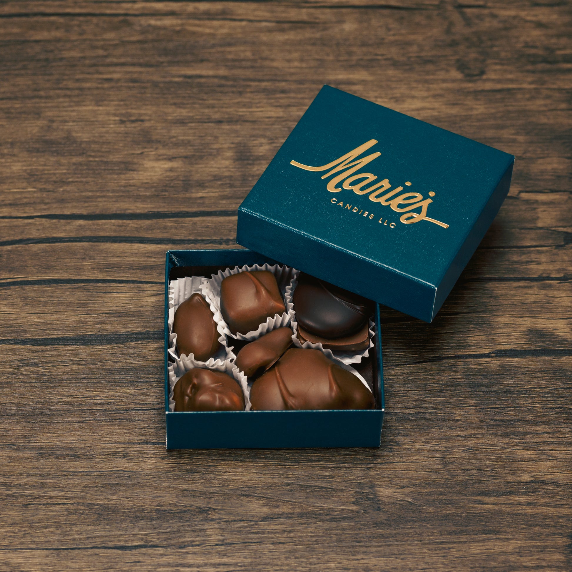 Seven mouthwatering pieces of Marie's chocolates, including at least one dark chocolate piece, as well as, our famous Tur'Kin (like a Turtle) and Peppermint Chew (one of Marie's first recipes).