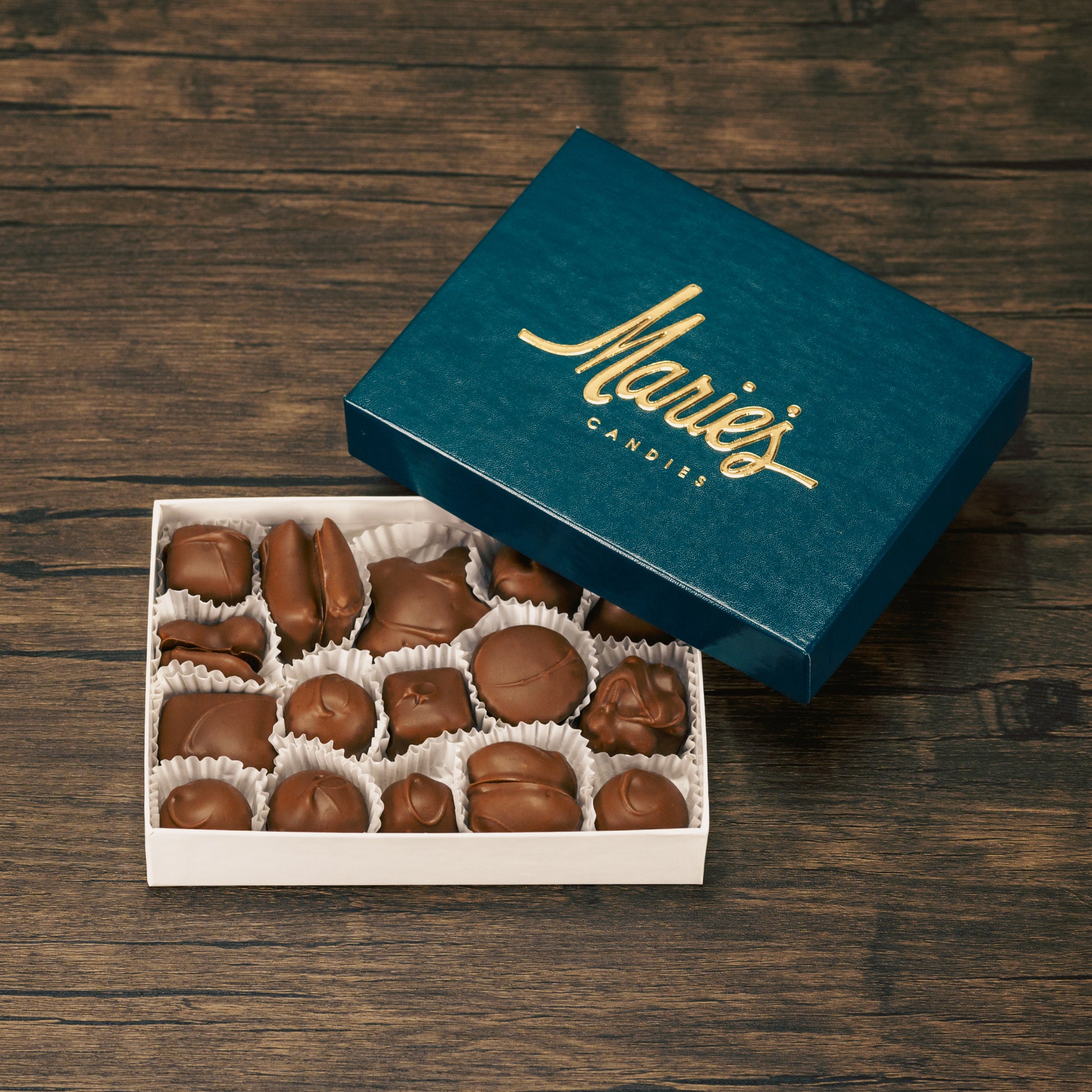 Half pound box of assorted chocolates. Choose between an all milk chocolate, milk and dark chocolate or all dark chocolate assortment. Includes a variety of creams, caramels and crunchy pieces., such as Butter Creams, Peppermint Chews, Peanut Butter and our famous Tur'Kins.