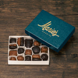 Half pound box of assorted chocolates. Choose between an all milk chocolate, milk and dark chocolate or all dark chocolate assortment. Includes a variety of creams, caramels and crunchy pieces., such as Butter Creams, Peppermint Chews, Peanut Butter and our famous Tur'Kins.