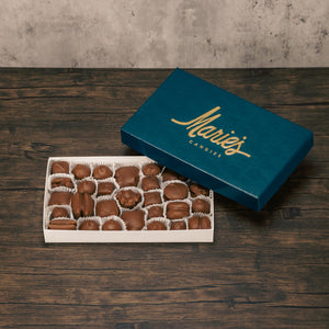 A one pound box of assorted chocolates. Choose an all milk chocolate, milk and dark assortment or all dak chocolate assortment. Approximately 34 pieces of candy. Includes a variety of creams, caramels and crunchy pieces., such as Butter Creams, Peppermint Chews, Peanut Butter and our famous Tur'Kins.