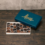 A one pound box of assorted chocolates. Choose an all milk chocolate, milk and dark assortment or all dak chocolate assortment. Approximately 34 pieces of candy. Includes a variety of creams, caramels and crunchy pieces., such as Butter Creams, Peppermint Chews, Peanut Butter and our famous Tur'Kins.