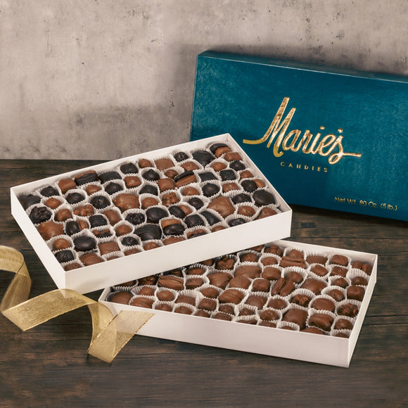 A five pound box of assorted chocolates. Choose between a milk chocolate or milk and dark chocolate assortment. Pieces include creams, caramels and crunchy pieces., and our famous Tur'Kins, like a turtle. Approximately 150 pieces.