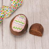 This egg has a rich fudgy chocolate center and is covered in milk or dark chocolate. Assorted sugar and icing decorations, choose a quarter pound, half pound or one pound egg.