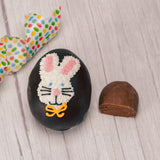 This egg has a rich fudgy chocolate center and is covered in milk or dark chocolate. Assorted sugar and icing decorations, choose a quarter pound, half pound or one pound egg.