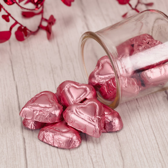 pink foil wrapped milk chocolate hearts in half pound bags.