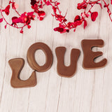 Milk Chocolate letters spell out your LOVE for someone special. Comes in a box with a clear lid..