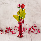 long stem milk chocolate rose wrapped in red or pink foil.