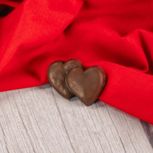 milk chocolate double heart placed in a clear cello bag and sealed. Perfect for a party favor. Bite-sized.