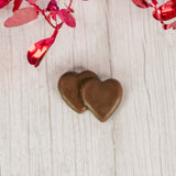 milk chocolate double heart placed in a clear cello bag and sealed. Perfect for a party favor. Bite-sized.