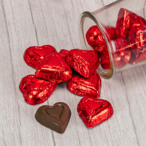 Half pound milk chocolate hearts wrapped in red foil.