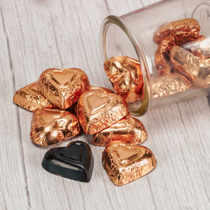 a half pound of rich dark chocolate hearts wrapped in gold foil.