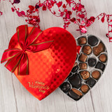 classic red foil heart box filled with assorted chocolates that reads 'Happy Valentine's Day'. Choose a milk chocolate, dark chocolate or milk  and dark chocolate assortment.