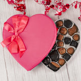 pink satin heart box filled with assorted chocolates. Choose milk chocolates, dark chocolates, or a mix of milk and dark.