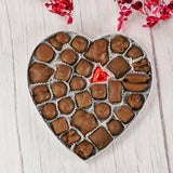 classic red foil heart box filled with assorted chocolates that reads 'Happy Valentine's Day'. Choose a milk chocolate, dark chocolate or milk and dark chocolate assortment.