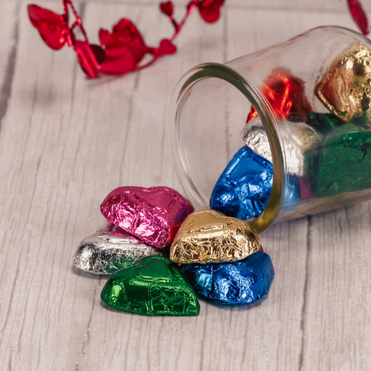 half pound bag of milk chocolate hearts wrapped in rainbow colored foil