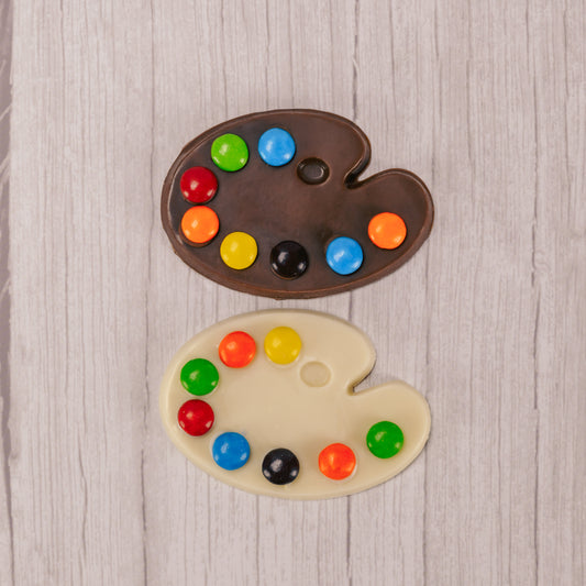 A painter's palette in milk chocolate or white coating (tastes like white chocolate)with M&Ms representing paint colors.