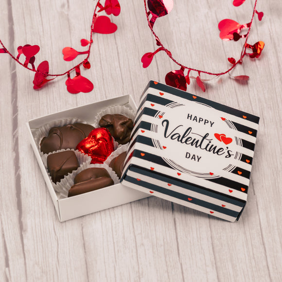 Need a little treat for your friends and family this Valentine's Day? A square black and white striped box that reads 'Happy Valentine's Day' on top is filled with about eight pieces of our delightful Assorted Chocolates This will be just what they need and deserve!